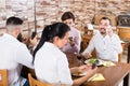 Group of friends using smartphones at restaurant Royalty Free Stock Photo