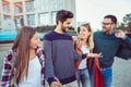 Group Of Friends Walking Along Street With Shopping Bags Royalty Free Stock Photo