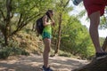 Group of friends walking with backpacks in forest. backpack hiking in the woods. Adventure, travel, tourism, active rest, hike and Royalty Free Stock Photo