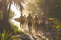 Group of friends walking to the beach at sunset with surfboards Royalty Free Stock Photo