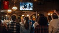 Group of Friends Watching a Live Ice Hockey Match on TV in a Sports Bar. Excited Fans Cheering and Royalty Free Stock Photo