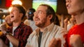 Group of Friends Watching a Live Soccer Match on TV in a Sports Bar. Happy Fans Cheering and Royalty Free Stock Photo