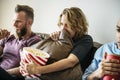 Group of friends watching movie together Royalty Free Stock Photo