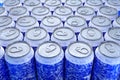 Group of frozen blue aluminum energy drink cans from above close up full frame