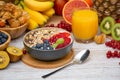 Group Fruits Breakfast mixed vegetables with salad bowl, nuts bowl, strawberry, banana, and pineapple, orange juice, vitamin c in