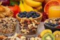 Group Fruits Breakfast mixed vegetables with salad bowl, nuts bowl, strawberry, banana, and pineapple, orange juice, vitamin c in