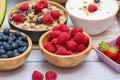 Group Fruits mixed and vegetables with salad bowl, nuts bowl, strawberry, banana, and pineapple, orange juice,  vitamin c in food Royalty Free Stock Photo