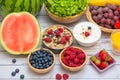 Group Fruits mixed and vegetables with salad bowl, nuts bowl, strawberry, banana, and pineapple, orange juice,  vitamin c in food Royalty Free Stock Photo