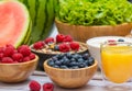 Group Fruits mixed and vegetables with salad bowl, nuts bowl, strawberry, banana, and pineapple, orange juice,  vitamin c in food Royalty Free Stock Photo