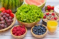 Group Fruits mixed and vegetables with salad bowl, nuts bowl, strawberry, banana, and pineapple, orange juice,  vitamin c in food Royalty Free Stock Photo