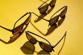 Group of full rim sunglasses is on yellow background. Royalty Free Stock Photo