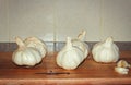 Group Of Garlic Cloves Up Close Wooden Chopping Board