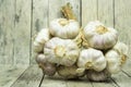 Group of garlic on wooden plank