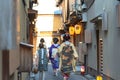 A group of geisha and maiko wearing traditional dress kimono walking on street Royalty Free Stock Photo