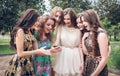 Group of girls looking at a cell phone Royalty Free Stock Photo