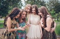 Group of girls looking at a cell phone Royalty Free Stock Photo