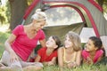 Group Of Girls With Mother Having Fun In Tent In Countryside Royalty Free Stock Photo