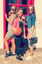 Group of girls posing with basketball ball