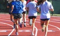 Group of girls running on a track Royalty Free Stock Photo