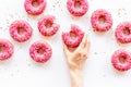 Group of glazed pink donutes. Sweet bakery background