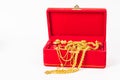 Group of gold necklace and gold ring of accessories in red box Royalty Free Stock Photo