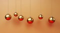 Group of golden Christmas balls hanging from strings. Perfect for festive decorations and holiday