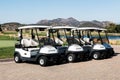 Group of Golf Carts Near a Lake and Mountains at Barona Creek Golf Club Royalty Free Stock Photo