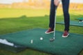 Group of golfers practicing and training golf swing on driving range practice, men playing on golf course, golf ball at golfing Royalty Free Stock Photo