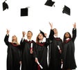 Group of graduated students throwing hats Royalty Free Stock Photo