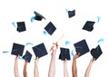 Group of Graduating Student`s Hands Holding and Throwing Graduat Royalty Free Stock Photo