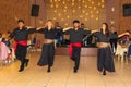 A group of Greek dancers performing at arestaurant