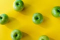 Group of green apples on yellow background Royalty Free Stock Photo