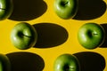 Group of green apples on yellow background Royalty Free Stock Photo