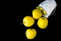 A group of green Granny Smith and golden apples in a white bucket against a dark brown background, copy space for text Royalty Free Stock Photo