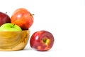 Group of green and red Apple fruit on a wooden bowl / basket isolated on white background Royalty Free Stock Photo