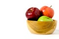 Group of green and red Apple fruit on a wooden bowl / basket isolated on white background Royalty Free Stock Photo