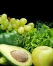 Group of green vegetables and fruits on black Royalty Free Stock Photo