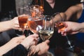 Group of guests celebrate and raise glasses, cheering with alcohol glasses with wine and champagne in the restaurant on corporate Royalty Free Stock Photo