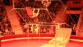 Group of gymnasts performing unimaginable tricks on horizontal bars in circus