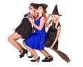Group Halloween witch in costume fly on broom. Royalty Free Stock Photo