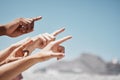 Group hands, fingers and pointing to sky mockup, direction and advertising space of global community outdoors. Closeup Royalty Free Stock Photo
