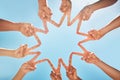 Group, hands and fingers with star for peace, solidarity and blue sky in sunshine on vacation. Friends, family and fun Royalty Free Stock Photo