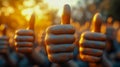 Group of hands giving a thumbs-up gesture in approval Royalty Free Stock Photo