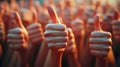 Group of hands giving a thumbs-up gesture in approval Royalty Free Stock Photo