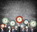 Group of Hands Holding Clock