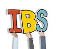 Group of Hands Holding IBS Letter