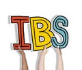 Group of Hands Holding IBS Letter