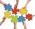 Group of Hands Holding Jigsaw Puzzle Royalty Free Stock Photo