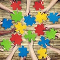 Group of Hands Holding Jigsaw Puzzle Royalty Free Stock Photo