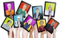 Group of Hands Holding Tablets with People's Faces Royalty Free Stock Photo